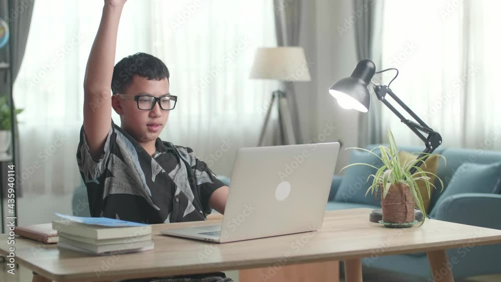 Teenage Boy Learning Online From Laptop, Raising Hand Distance Learning Online At Virtual Lesson Class With Teacher Tutor On Laptop By Video Conference
Teenage Boy Learning Online From Laptop, Raising Hand Distance Learning Online At Virtual Lesson Class With Teacher Tutor On Laptop By Video Conference