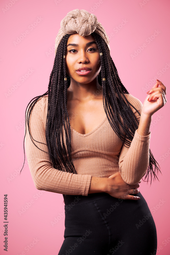 Happy Biracial Woman Posing In Front Of Pink Background Happy Biracial Woman Posing In Front Of Pink Background