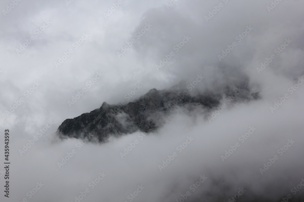 Fototapeta premium The Mountain Peak in Clouds | Cloud Cover Mountain 