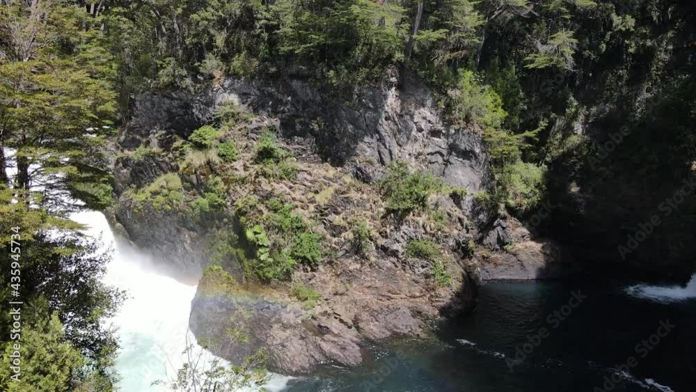 4K Aerial orbit shot of lovely peaceful waterfalls in jungle forest of Patagonia. Beautiful sunny day in wilderness of Argentina. 4K Aerial orbit shot of lovely peaceful waterfalls in jungle forest of Patagonia. Beautiful sunny day in wilderness of Argentina.