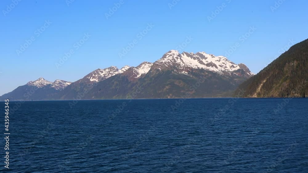 Blue Sea And Snowcapped Mountains On Sunny Day During Winter - Whittier, Alaska Blue Sea And Snowcapped Mountains On Sunny Day During Winter - Whittier, Alaska