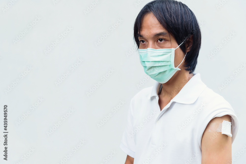asian man get vaccinated of covid-19 asian man get vaccinated of covid-19