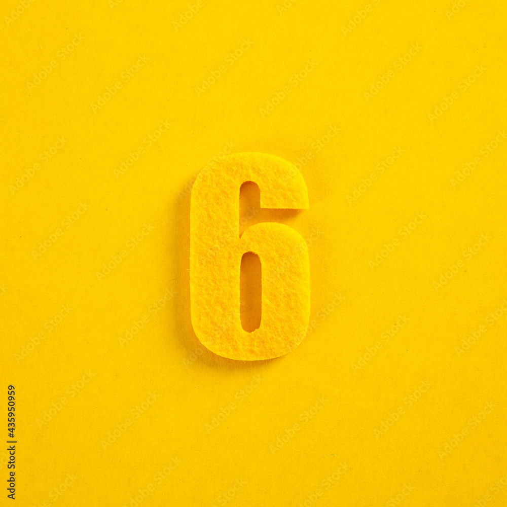 A colorful number on yellow background A colorful number on yellow background