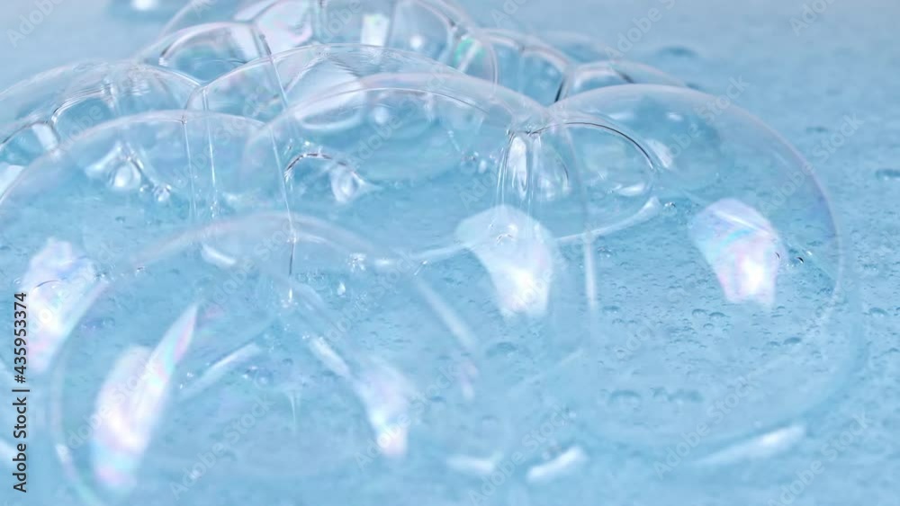 Macro Shot of air Bubbles in Transparent Cosmetic Liquid Gel Cream. Blue Cosmetic Fluid texture With Bubbles. Slow motion . High quality 4k footage Macro Shot of air Bubbles in Transparent Cosmetic Liquid Gel Cream. Blue Cosmetic Fluid texture With Bubbles. Slow motion . High quality 4k footage