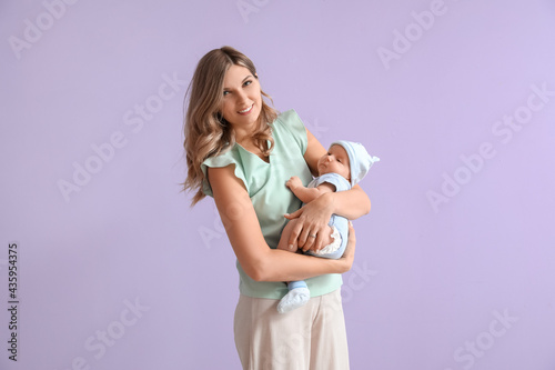 Happy mother with cute litt...