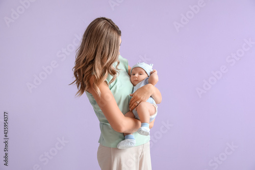 Happy mother with cute litt...