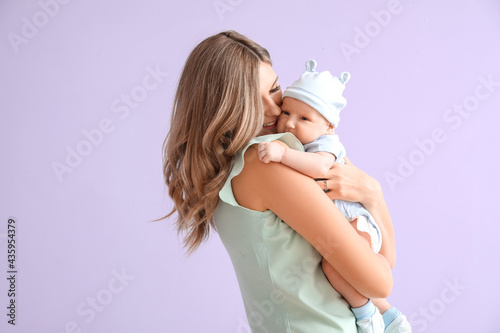 Happy mother with cute litt...