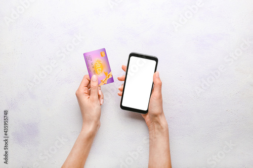 Woman with gift card and mo...
