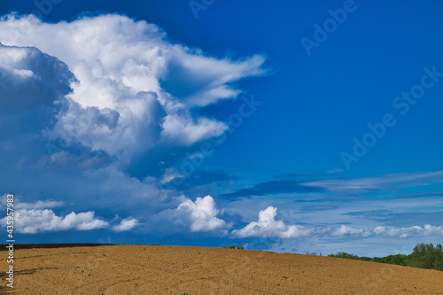 Large arable land under the beautiful sky in Maransart, Lasne, Belgium photo