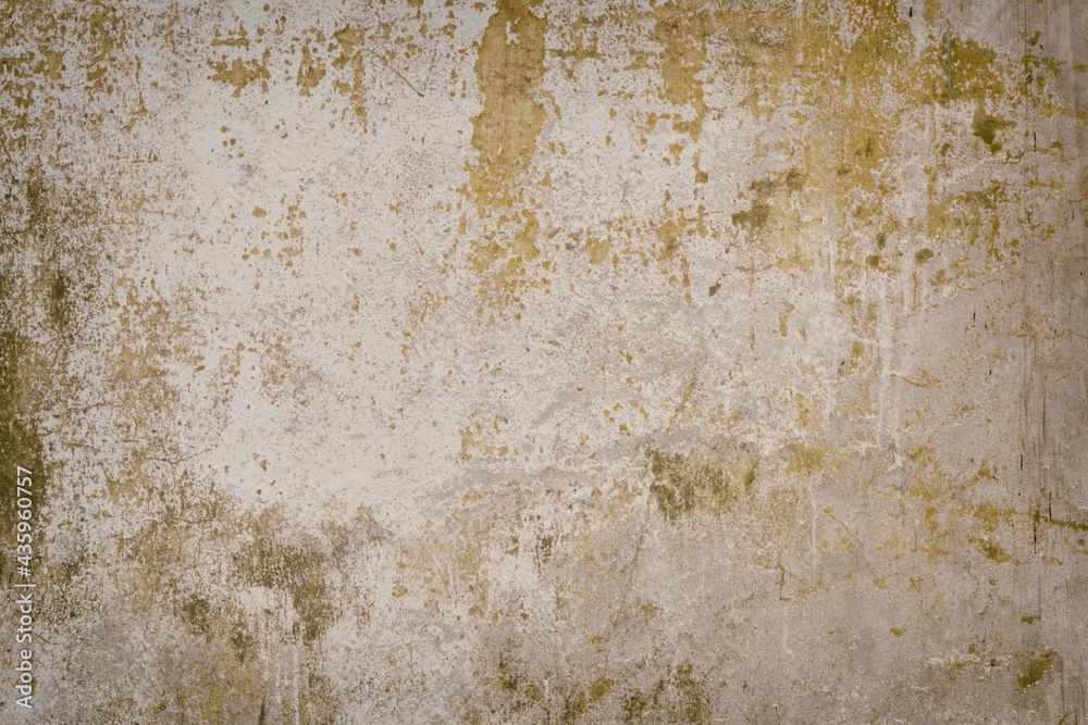 Interior background with texture of old painted concrete wall with peeling plaster.