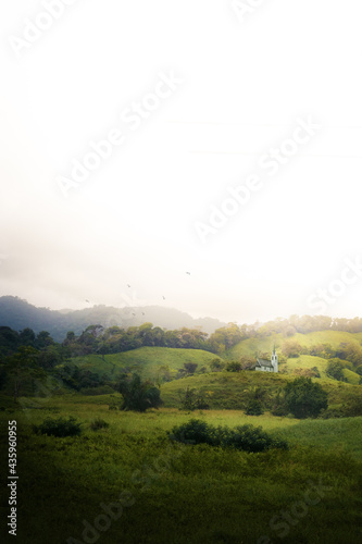 Fototapet Landscape of green hills and house in the middle of the forest