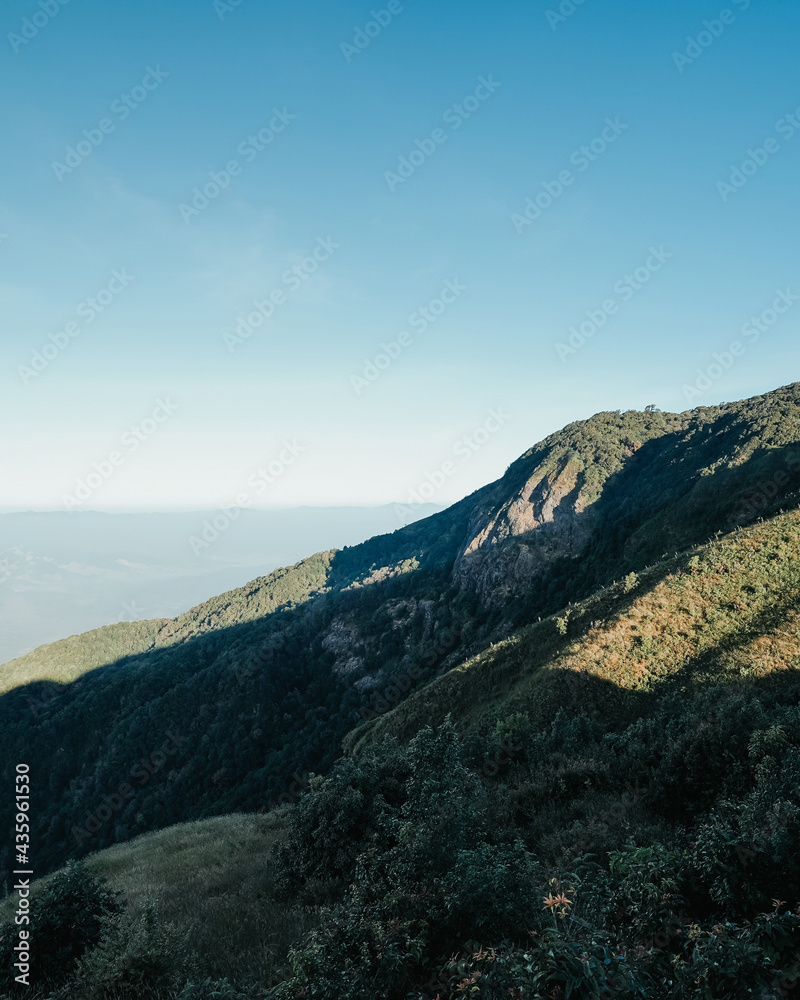 beautiful blue sky high peak mountains green forest guiding for backpacker camping backpacking hiking idea long weekend at Kew Mae Pan Nature Trail Waterfall Doi Inthanon, Chiang Mai, Thailand.