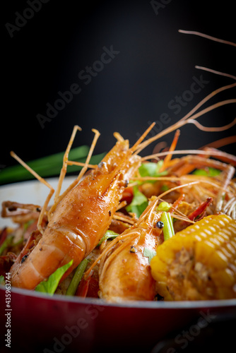 Spicy seafood bucket, Cook spicy shrimp mixed seafood Thai style, Thai foods.  © teerawat