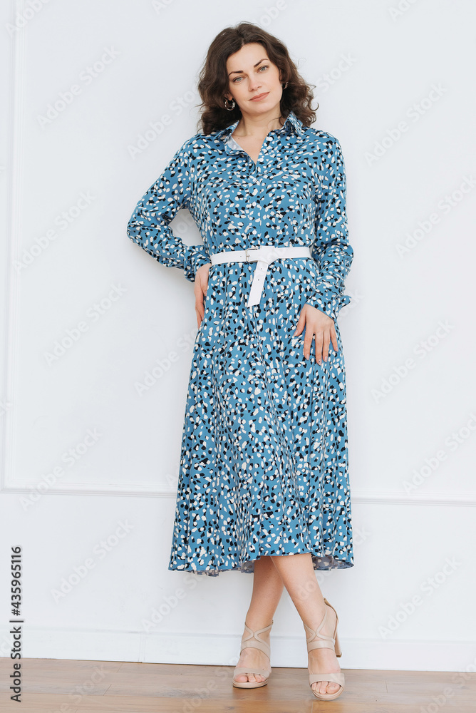 Portrait of pretty young caucasian woman with light natural make up on the background of white wall at home Portrait of pretty young caucasian woman with light natural make up on the background of white wall at home