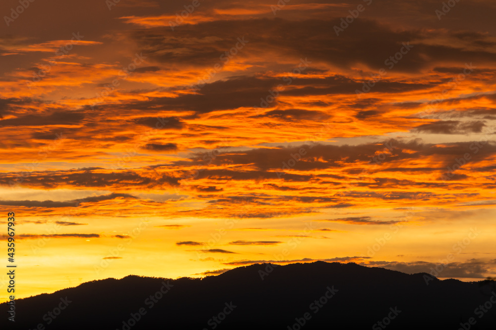 Sunset behind a mountain