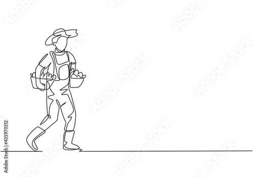Single continuous line drawing male farmer carrying boxes and baskets of fruit in his right and left hands. Successful harvest minimalism concept. One line draw graphic design vector illustration