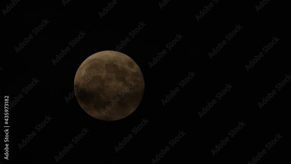 Full Moon movement across the sky on May 26, 2021. Halloween Moon concept. Full Moon movement across the sky on May 26, 2021. Halloween Moon concept.