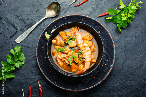 Tom yum soup with seafood and coconut milk,top view