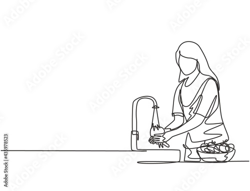 Continuous one line drawing a woman was washing the fruit in the sink from the bacteria that stick to it thoroughly. Using splash and water flow. Single line draw design vector graphic illustration.