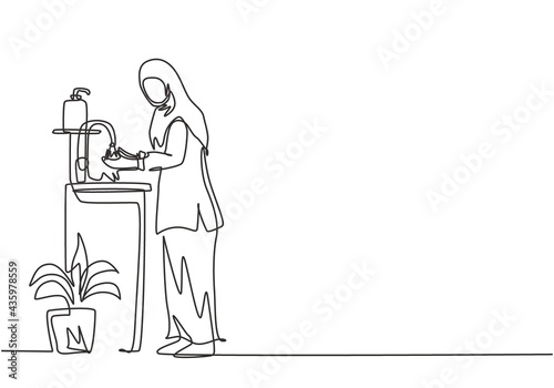 Continuous one line drawing a woman in a hijab washes her hands in the sink, there is a soap dish near the faucet and pot of plants under the sink. Single line draw design vector graphic illustration.