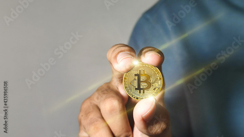 Bitcoin gold coin. Business man with bitcoins. Virtual cryptocurrency concept.