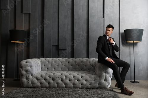 Fotografía Handsome businessman in stylish living room. Luxury lifestyle