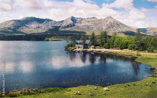 Beautiful landscape scenery of lough inagh with mountains in the background and lake house in Connemara, county Galway, Ireland  photo