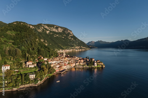 Varenna city on Lake Como with its walk on lakefront and mountains.