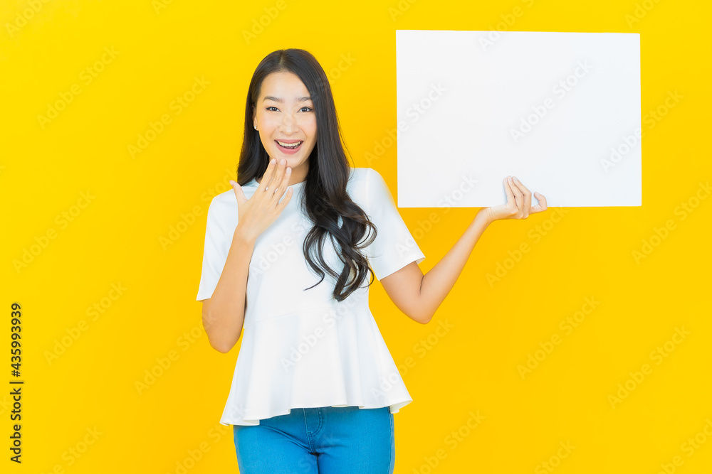 Portrait beautiful young asian woman with empty white billboard Portrait beautiful young asian woman with empty white billboard