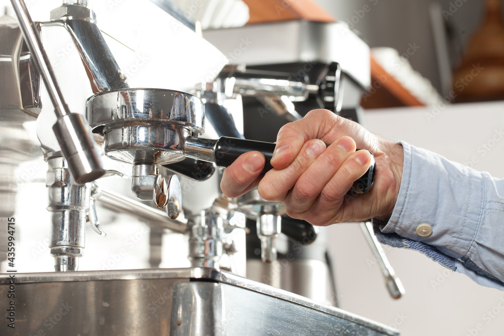 Close-up of espresso preparing in coffee machine, selective focus Close-up of espresso preparing in coffee machine, selective focus
