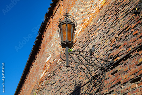 Lantern on an old brick wall.