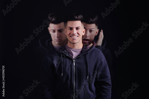 Vászonkép Man with personality disorder on dark background, multiple exposure