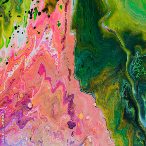 Abstract painting made of liquid acrylic with fluid art technique with colorful bright colors. photo