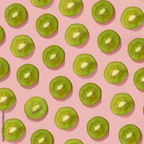 fresh green fruit on a pink background.trendy pattern summer concept