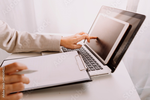 Social media and Marketing virtual icons screen concept.close up of businessman typing keyboard with laptop computer on wooden desk in modern office