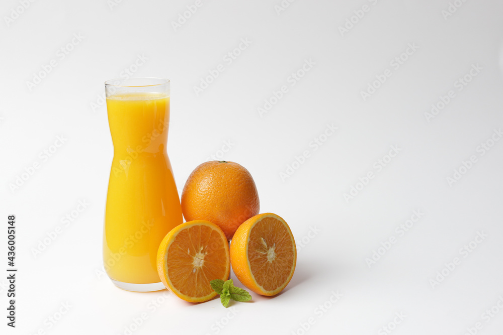 Bottle with fresh orange juice and mint.