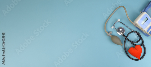 banner on blue background tonometer, fanndoscope and heart model