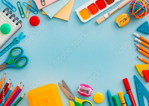 School supplies stationery on a blue background, back to school concept with copy space for text, flat lay, top view, mockup,