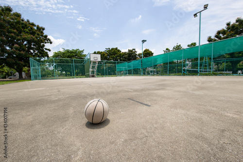 Basketball hoop with basketball ball in the public arena