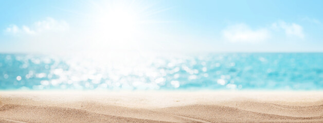 Sea beach with hot sand and sunny bokeh