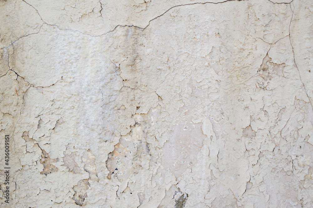 Old textured backdrop wall. Cracks, delamination. Grey colour. Old textured backdrop wall. Cracks, delamination. Grey colour.