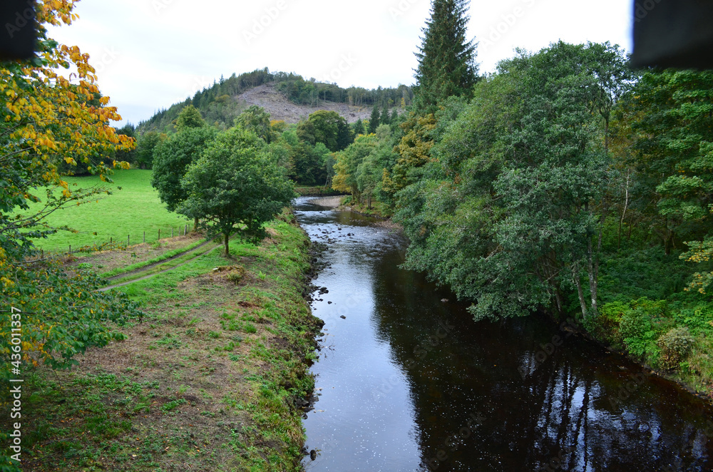 Pretty scenic countryside in Scotland with a flowing river Pretty scenic countryside in Scotland with a flowing river