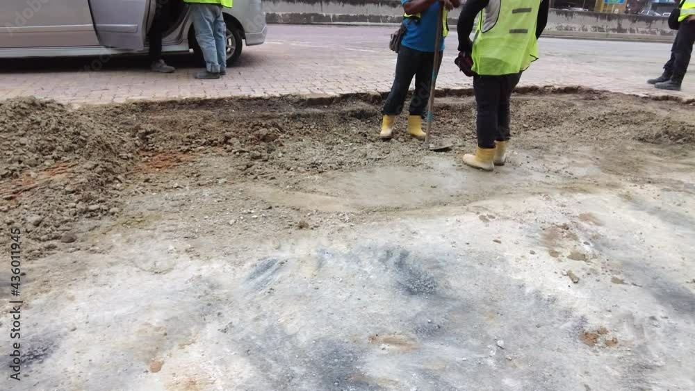 construction site next to the busy road with unidentified workers in Malaysia. construction site next to the busy road with unidentified workers in Malaysia.