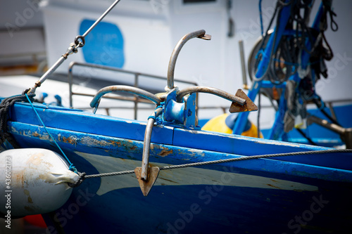 Painted bow of fishing boat docked on harbour