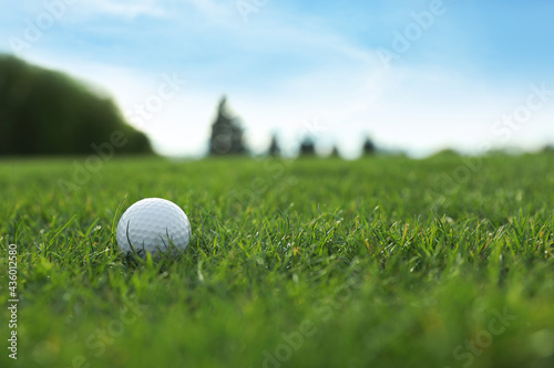 Golf ball on green course  space for text