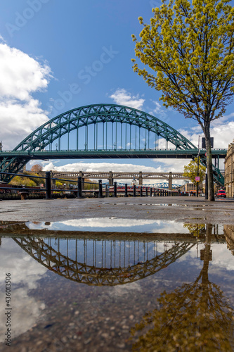 A general reflection view of the Tyne Bridge over the River Tyne in Newcastle upon Tyne, England © Zhou