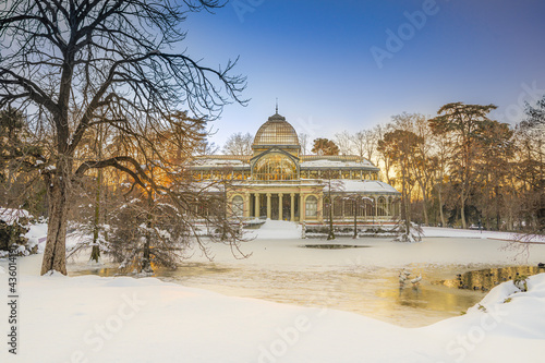 Crystal Palace in Retiro Park at sunset, after a heavy snowfall