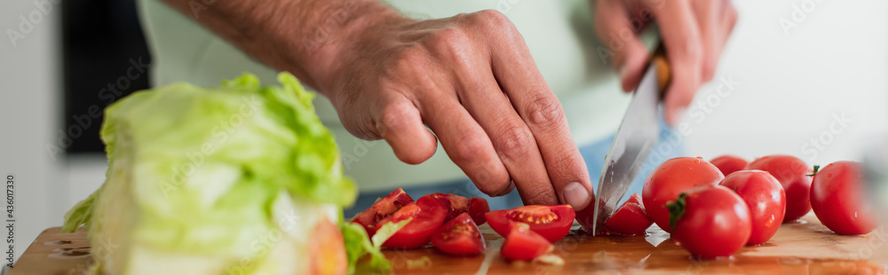 partial view of man cutting fresh vegetables in kitchen, banner partial view of man cutting fresh vegetables in kitchen, banner