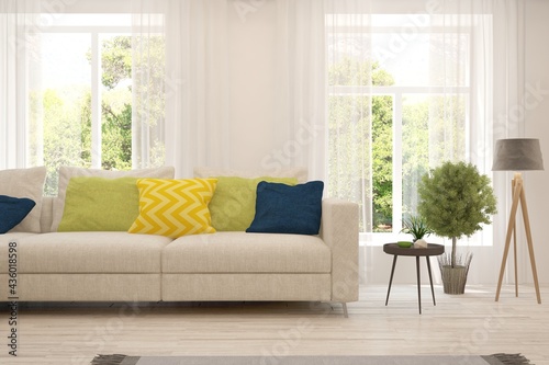 White living room with sofa and summer landscape in window. Scandinavian interior design. 3D illustration