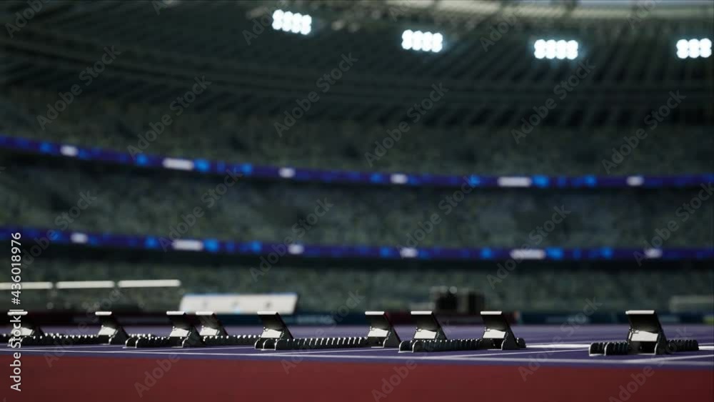 Sport outdoor athletics arena with start blocks on the runway. Stadium in the sunlight. High quality 4k footage